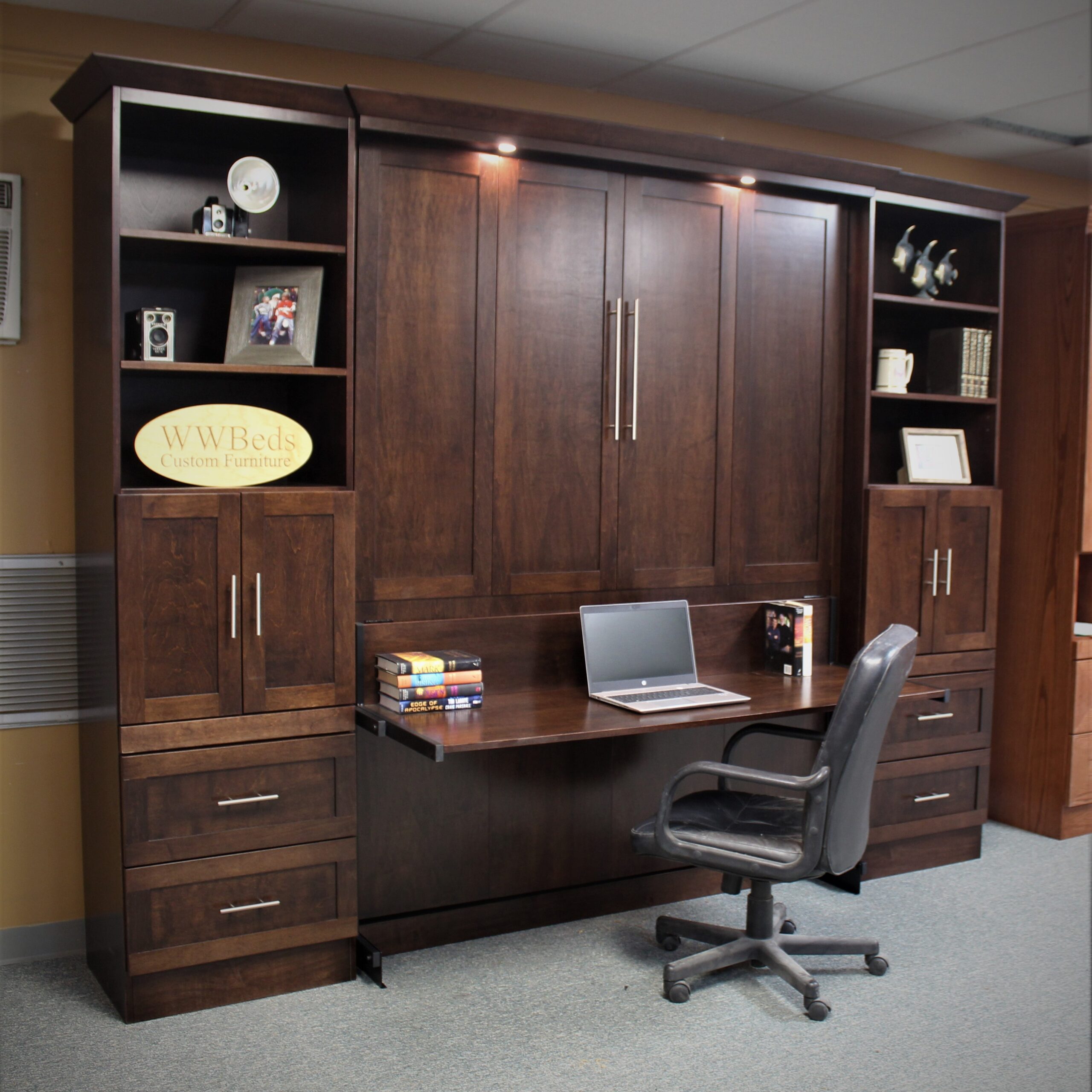 Dark murphy bed with desk and bookcases