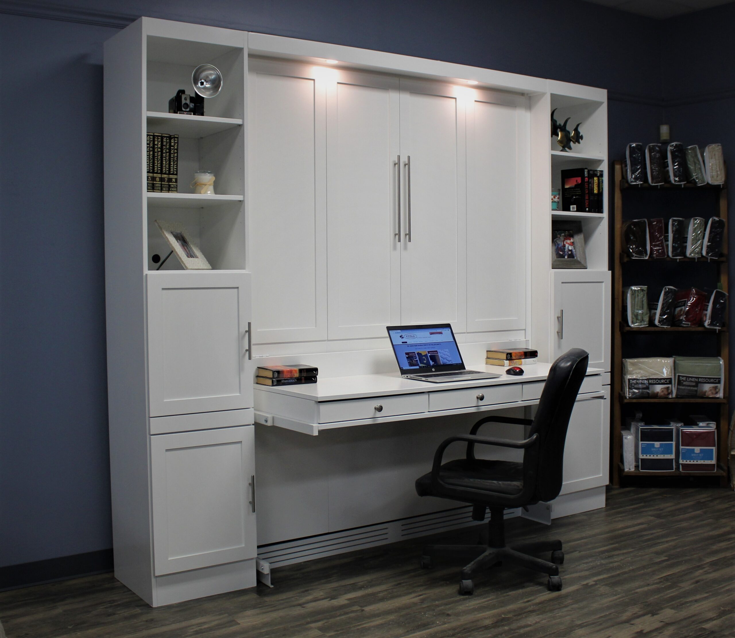 White Murphy bed with desk and bookcases