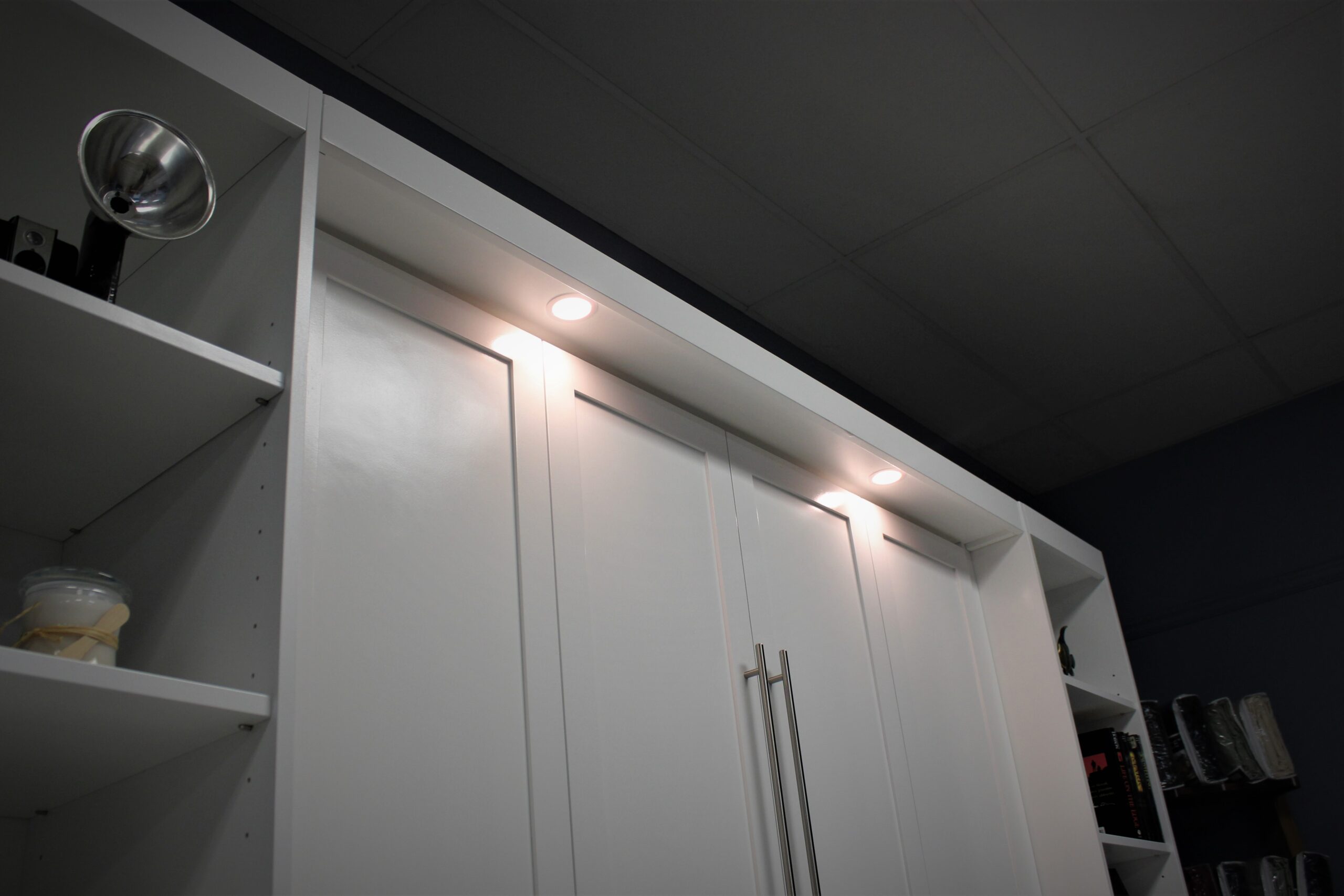 Murphy bed lights overhanging desk