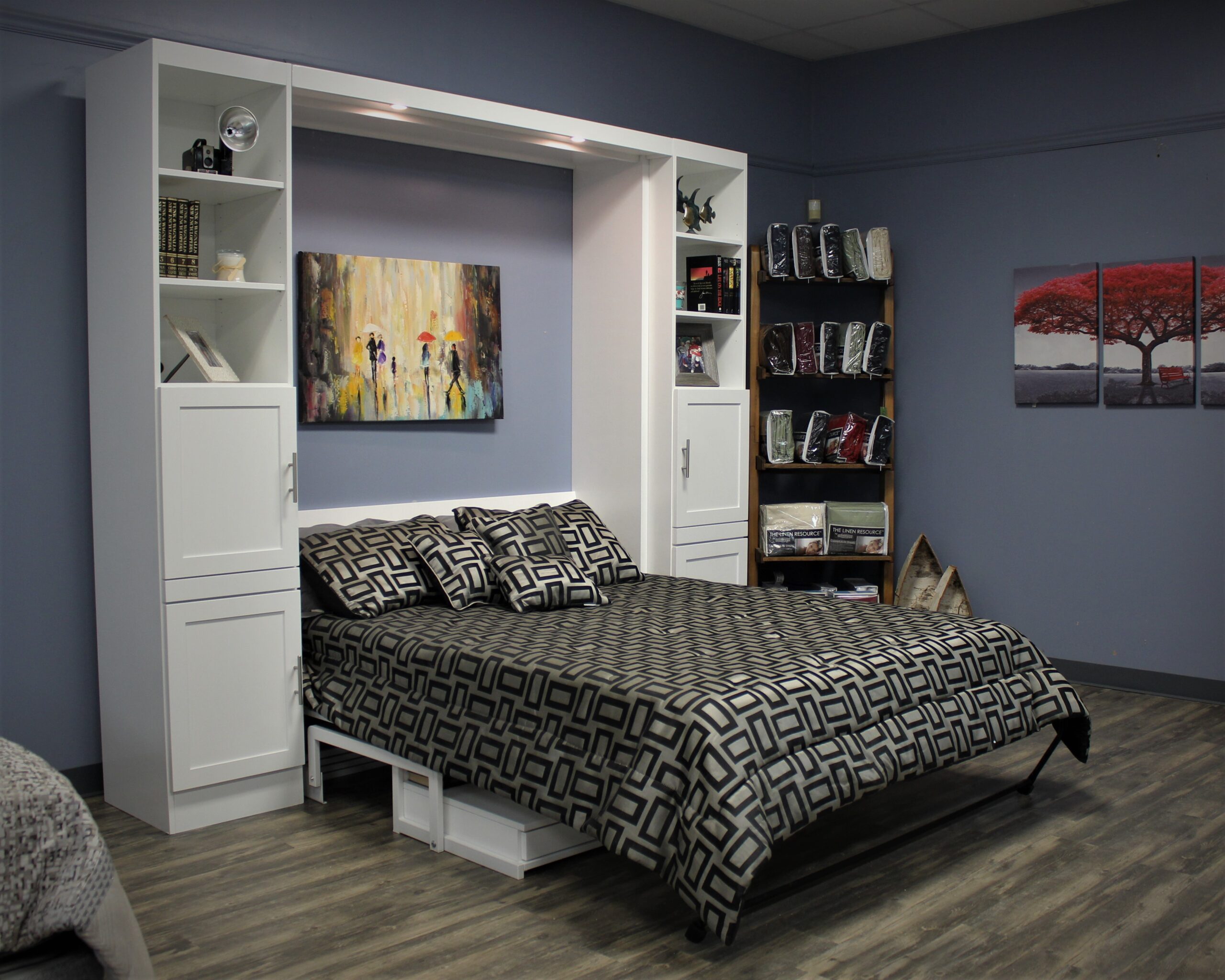 White murphy bed open with desk under the bed