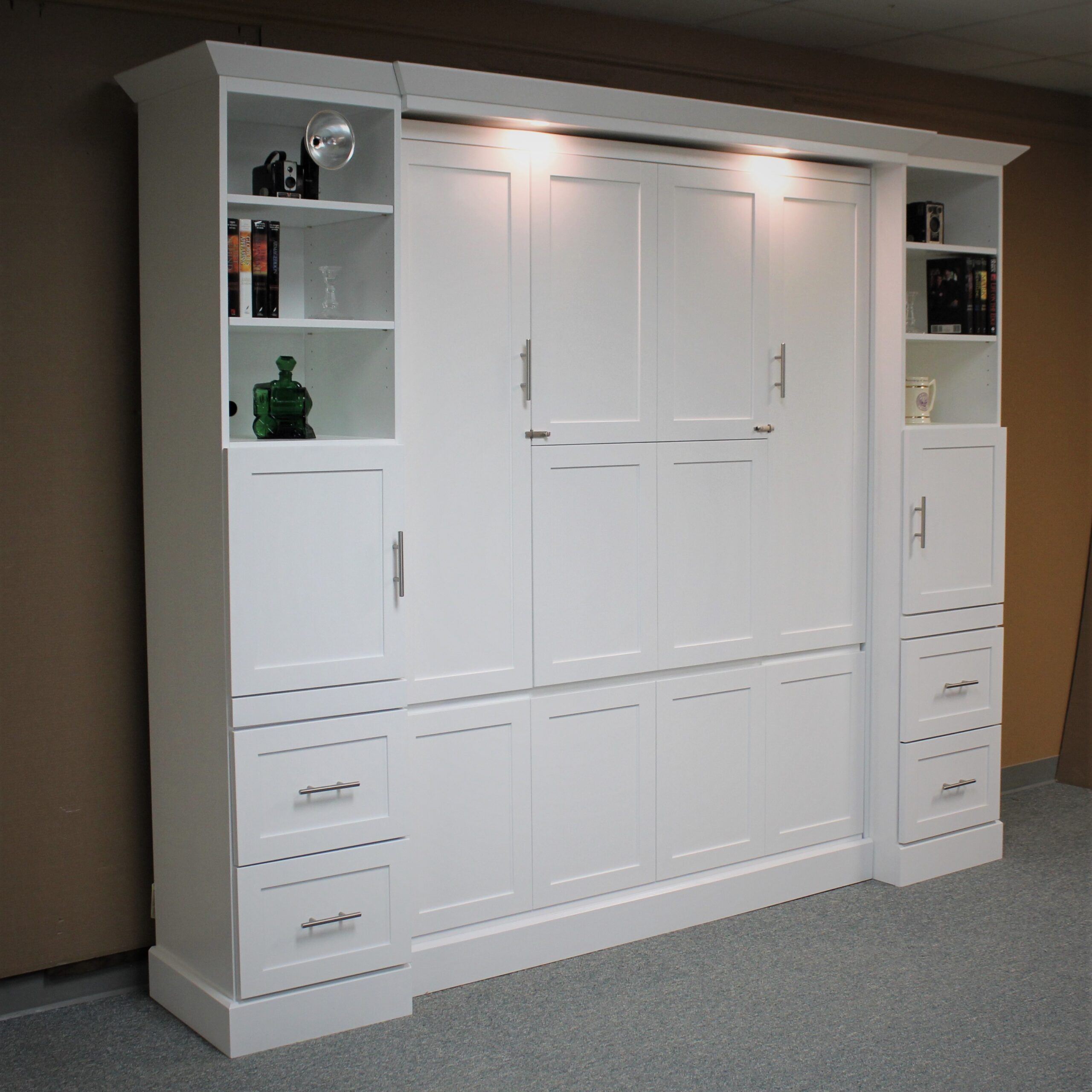 White Murphy bed with hidden desk shown closed