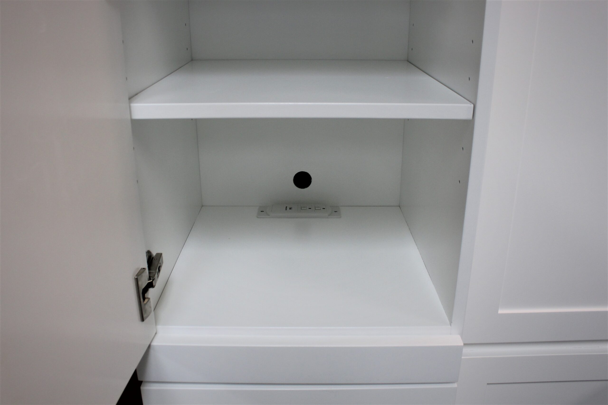 White Christy Murphy bed with hidden desk showing bookcase charging station