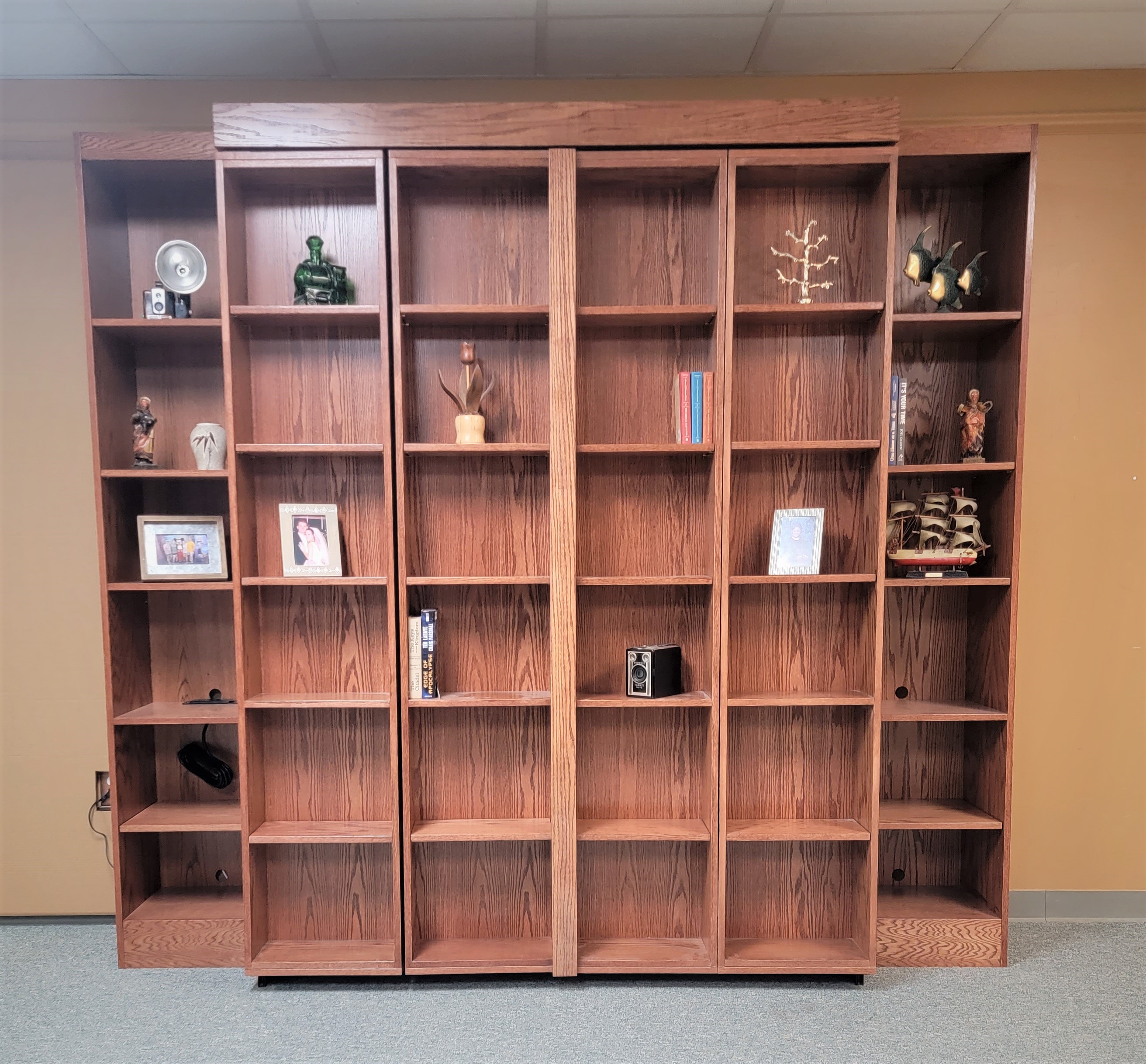 Red Chestnut Pivoting Bookcase Murphy Bed Front View of Murphy Bed Shown Closed